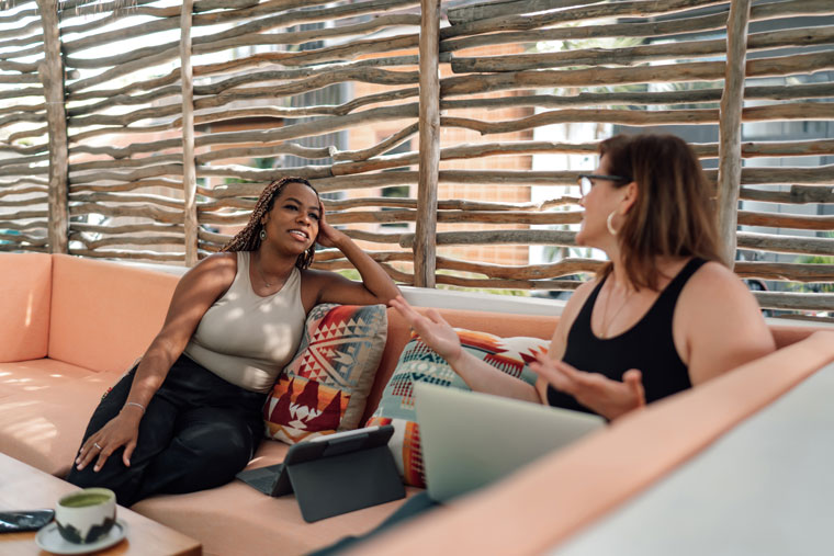 two people talking on sofa